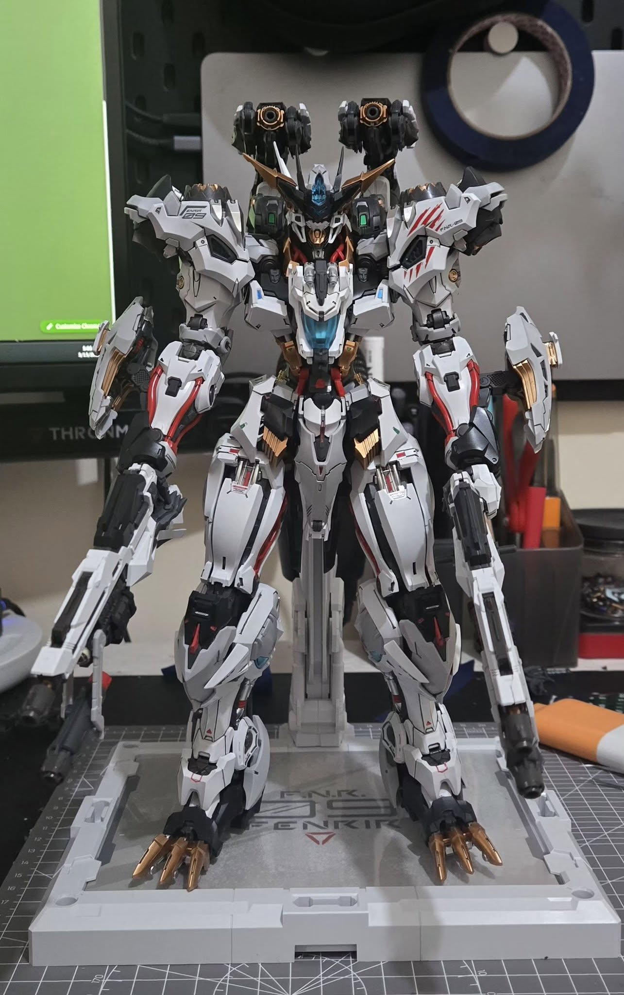Detailed completed Gunpla model on a work mat.